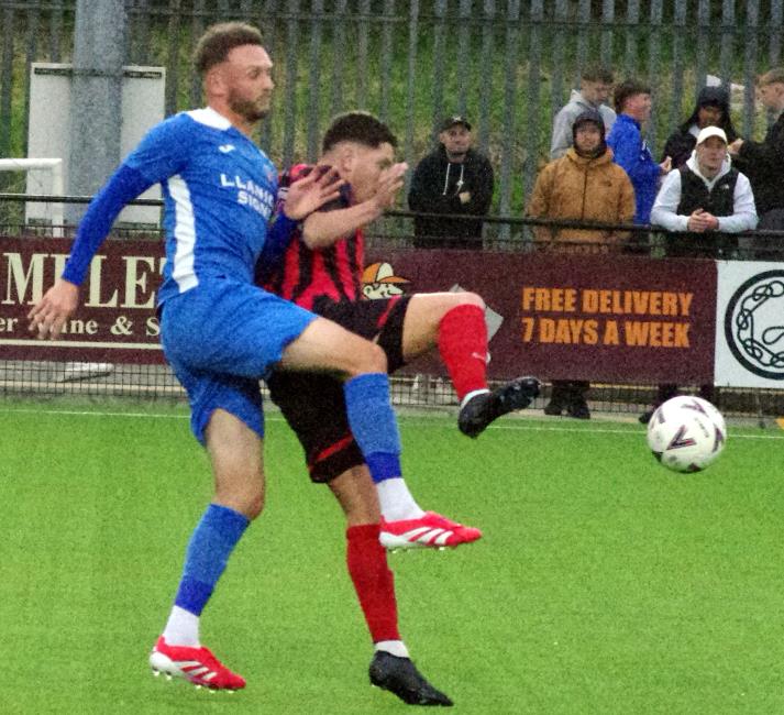Strong defending from Ben Steele who stops Scott Ferney in his tracks